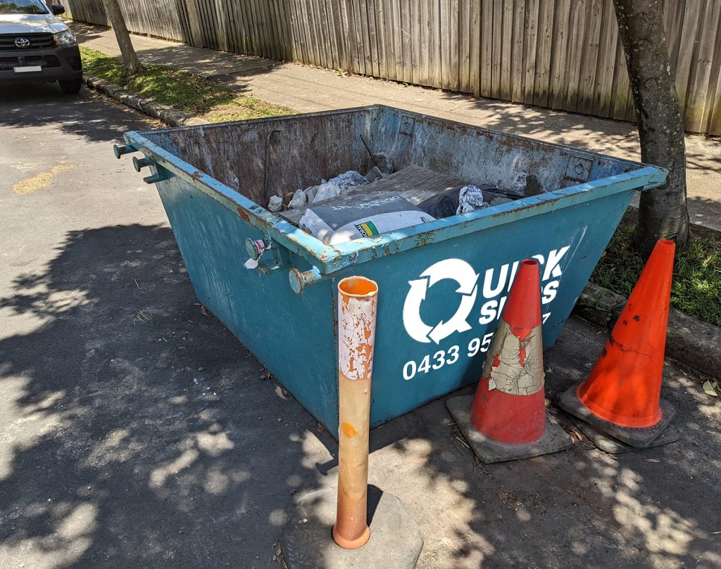 Small rubbish 2 cubic meter skip bin with no door on rear or side placed in driveway Inner West Sydney