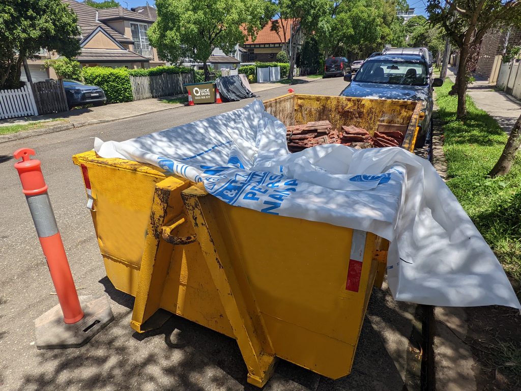6 cubic metre hooklift skip bin with standard skip across the road in Sydney